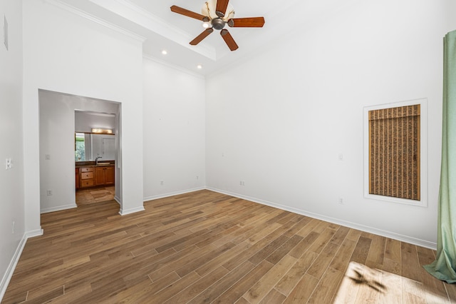 2928 Pine Valley Dr, Miramar Beach, FL 32550 - unfurnished bedroom with crown molding, wood finished floors, baseboards, a high ceiling, and recessed lighting
