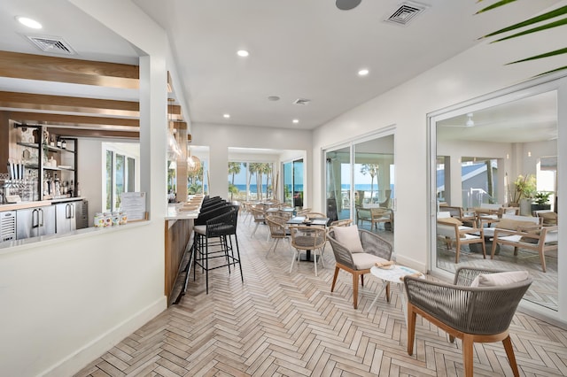 2928 Pine Valley Dr, Miramar Beach, FL 32550 - interior space featuring a community bar, baseboards, and visible vents
