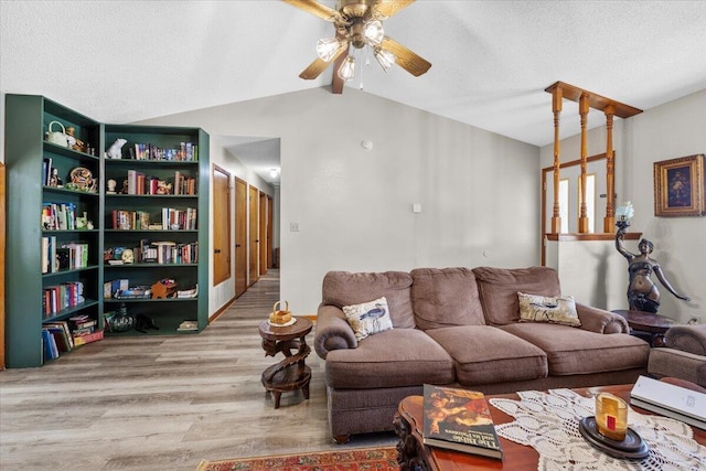 612 Moss Dr, Crestview, FL 32536 - living area with a ceiling fan, a textured ceiling, vaulted ceiling with beams, and wood finished floors