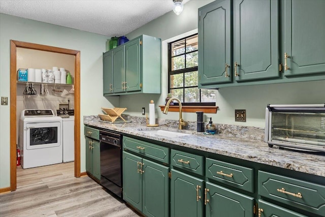 612 Moss Dr, Crestview, FL 32536 - kitchen featuring washer and dryer, a sink, a textured ceiling, black dishwasher, and light wood-type flooring