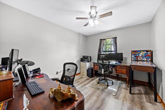 612 Moss Dr, Crestview, FL 32536 - home office with baseboards, a ceiling fan, a textured ceiling, and wood finished floors