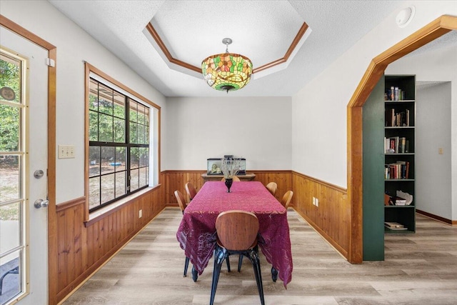 612 Moss Dr, Crestview, FL 32536 - dining space with wood finished floors, a wainscoted wall, and wooden walls