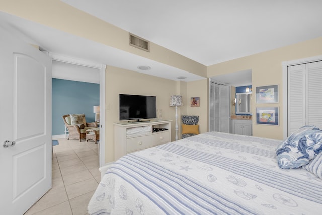 909 Santa Rosa Blvd Unit 241, Fort Walton Beach, FL 32548 - bedroom featuring multiple closets, visible vents, and light tile patterned floors