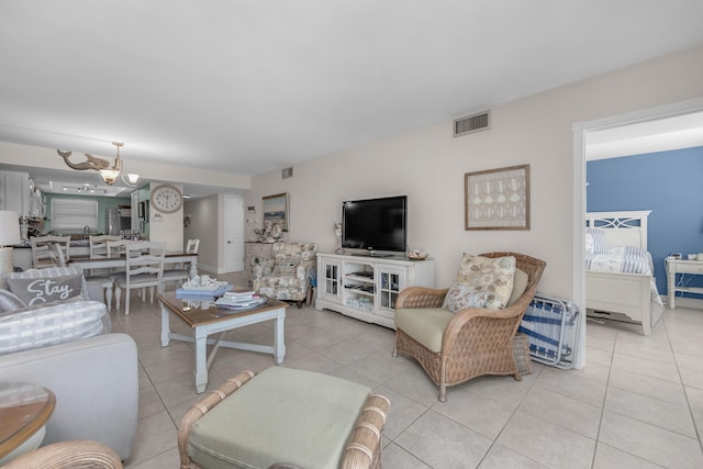 909 Santa Rosa Blvd Unit 241, Fort Walton Beach, FL 32548 - living room featuring a notable chandelier, visible vents, and light tile patterned floors