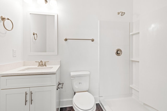 full bathroom with toilet, a shower, and vanity