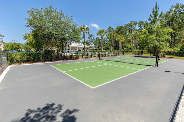 view of tennis court featuring community basketball court