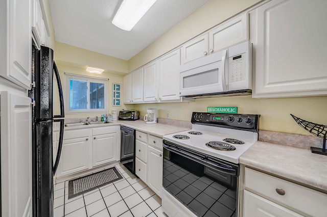 5801 Thomas Dr Unit 620, Panama City Beach, FL 32408 - kitchen with light tile patterned flooring, light countertops, white cabinetry, a sink, and black appliances