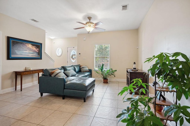 1901 Cottage Grove Ln Unit 1, Niceville, FL 32578 - living room with light tile patterned floors, ceiling fan, and baseboards