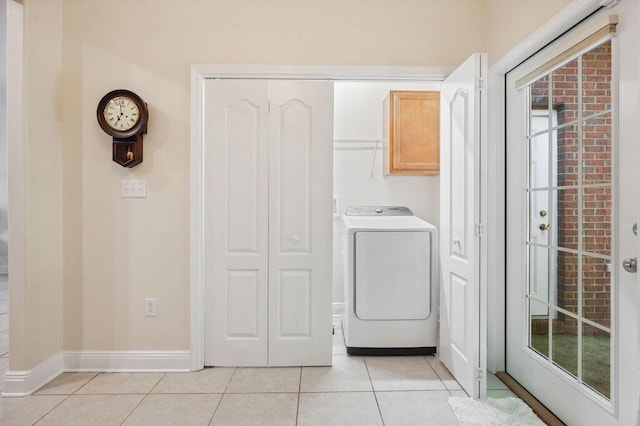 1901 Cottage Grove Ln Unit 1, Niceville, FL 32578 - washroom with washer / dryer, cabinet space, light tile patterned floors, and baseboards