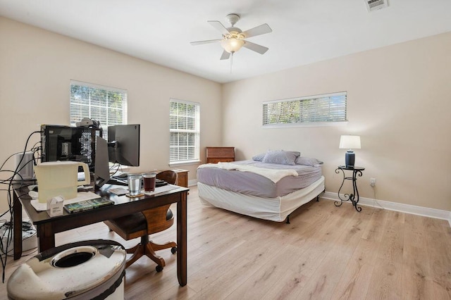 1901 Cottage Grove Ln Unit 1, Niceville, FL 32578 - bedroom with light wood finished floors, baseboards, an office area, and ceiling fan
