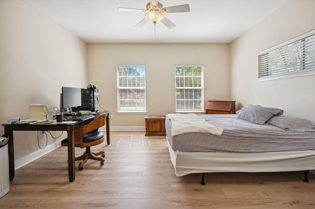 1901 Cottage Grove Ln Unit 1, Niceville, FL 32578 - bedroom with a desk, light wood-type flooring, baseboards, and ceiling fan