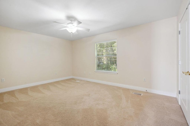 1901 Cottage Grove Ln Unit 1, Niceville, FL 32578 - empty room with a ceiling fan, light carpet, and baseboards