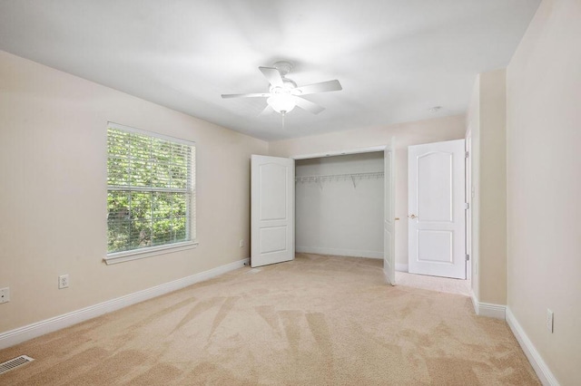 1901 Cottage Grove Ln Unit 1, Niceville, FL 32578 - unfurnished bedroom featuring light carpet, baseboards, a closet, and a ceiling fan