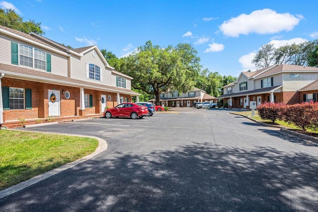 1901 Cottage Grove Ln Unit 1, Niceville, FL 32578 - view of asphalt road with a residential view and curbs