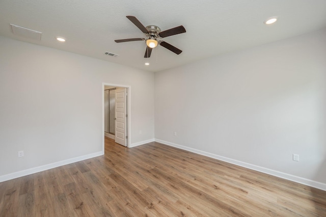 spare room with recessed lighting, baseboards, visible vents, ceiling fan, and wood finished floors
