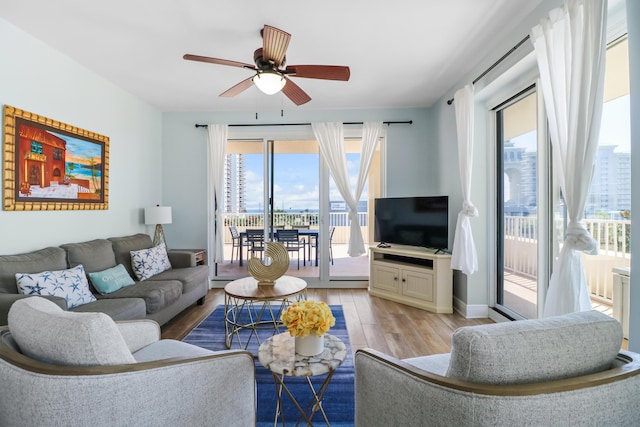 112 Seascape Dr Unit 310, Miramar Beach, FL 32550 - living room with ceiling fan, light wood-style flooring, and baseboards