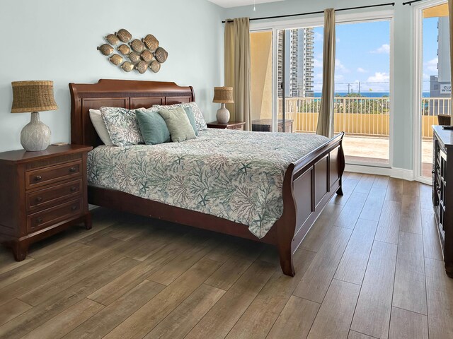 112 Seascape Dr Unit 310, Miramar Beach, FL 32550 - bedroom featuring hardwood / wood-style flooring and access to outside