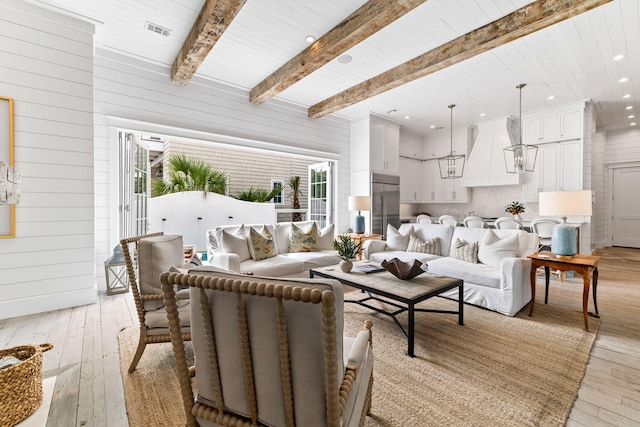 28 Rainer Ln, Inlet Beach, FL 32461 - living room with light wood-style flooring, beamed ceiling, wooden walls, and recessed lighting