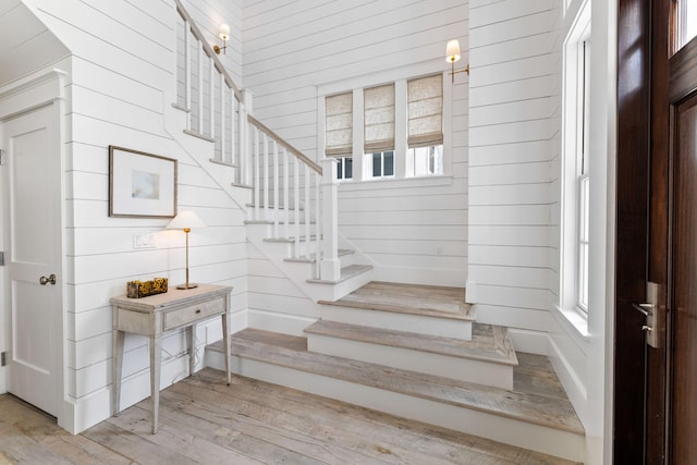28 Rainer Ln, Inlet Beach, FL 32461 - stairs featuring wooden walls and wood finished floors