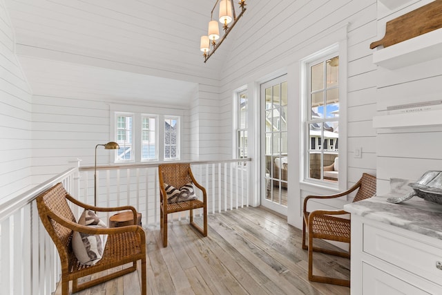 28 Rainer Ln, Inlet Beach, FL 32461 - sunroom / solarium featuring vaulted ceiling, wood walls, and wood-type flooring