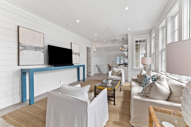 28 Rainer Ln, Inlet Beach, FL 32461 - living area with wood walls, wood finished floors, recessed lighting, wooden ceiling, and crown molding