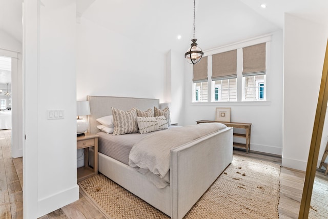 28 Rainer Ln, Inlet Beach, FL 32461 - bedroom featuring baseboards, recessed lighting, light wood-type flooring, and vaulted ceiling