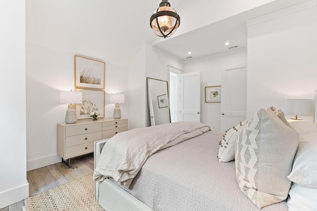 28 Rainer Ln, Inlet Beach, FL 32461 - bedroom featuring light wood-type flooring, visible vents, baseboards, ornamental molding, and recessed lighting