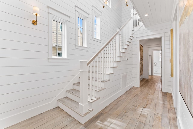 28 Rainer Ln, Inlet Beach, FL 32461 - stairway featuring wooden walls, wood-type flooring, and recessed lighting