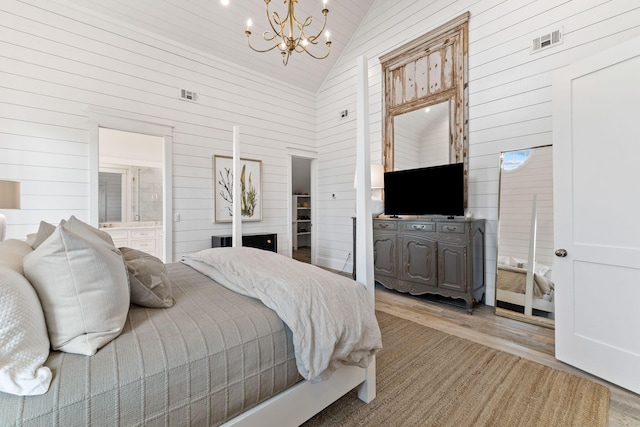 28 Rainer Ln, Inlet Beach, FL 32461 - bedroom with an inviting chandelier, wood walls, high vaulted ceiling, and visible vents