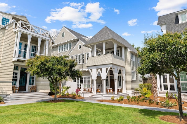 28 Rainer Ln, Inlet Beach, FL 32461 - back of property with a yard and a balcony