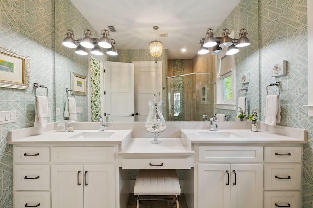 full bathroom featuring visible vents, a stall shower, tile walls, and vanity