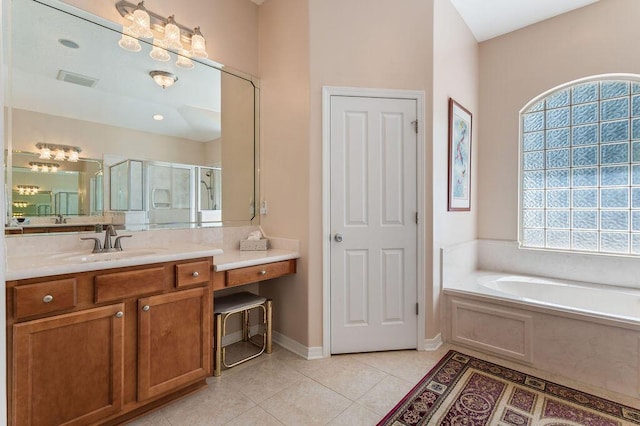full bathroom featuring a shower stall, vanity, tile patterned flooring, a garden tub, and baseboards