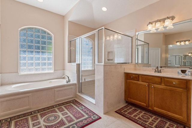 full bathroom with plenty of natural light, vanity, a shower stall, and a bath