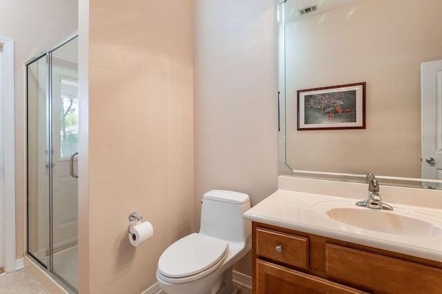 full bath with a stall shower, toilet, and vanity