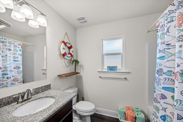 full bathroom with vanity, visible vents, wood finished floors, toilet, and a shower with shower curtain