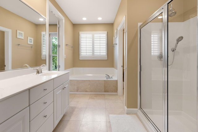 2021 Pine Island Cir, Miramar Beach, FL 32550 - full bathroom featuring vanity, a stall shower, a bath, and tile patterned flooring