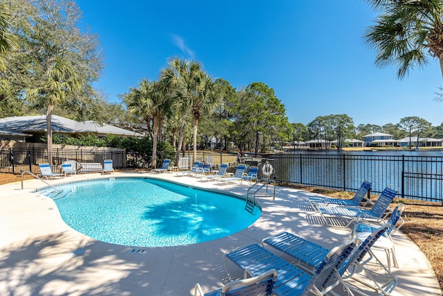 2021 Pine Island Cir, Miramar Beach, FL 32550 - community pool featuring fence, a water view, and a patio area