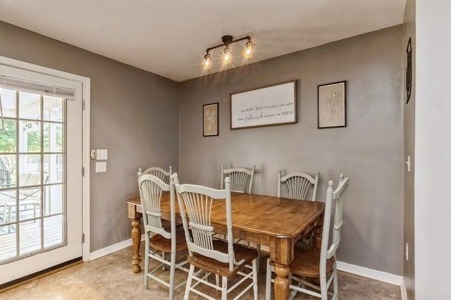 dining area featuring baseboards