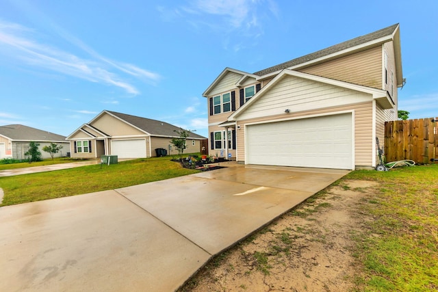traditional-style house featuring an attached garage, a front lawn, fence, and concrete driveway