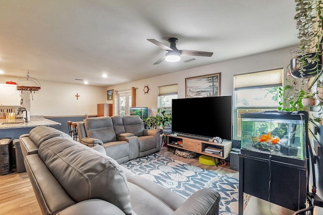 living area featuring recessed lighting, ceiling fan, light wood finished floors, and visible vents