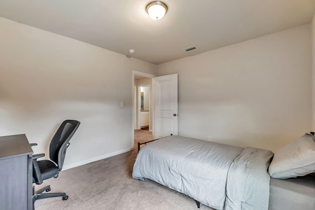 bedroom with carpet floors, baseboards, and visible vents