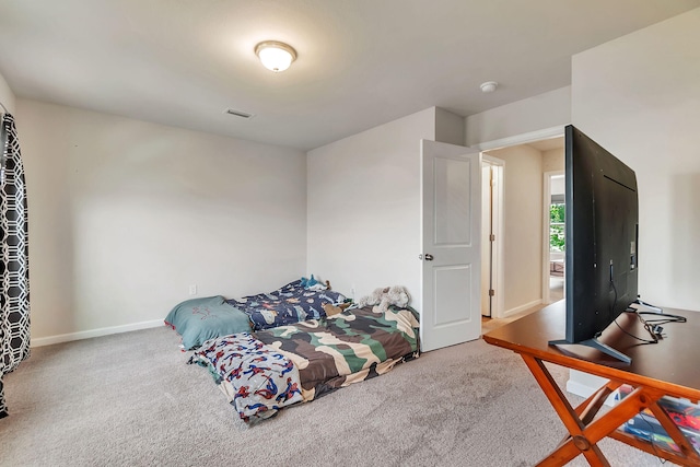 bedroom with carpet flooring, baseboards, and visible vents