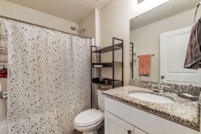 bathroom with toilet, a shower with shower curtain, and vanity