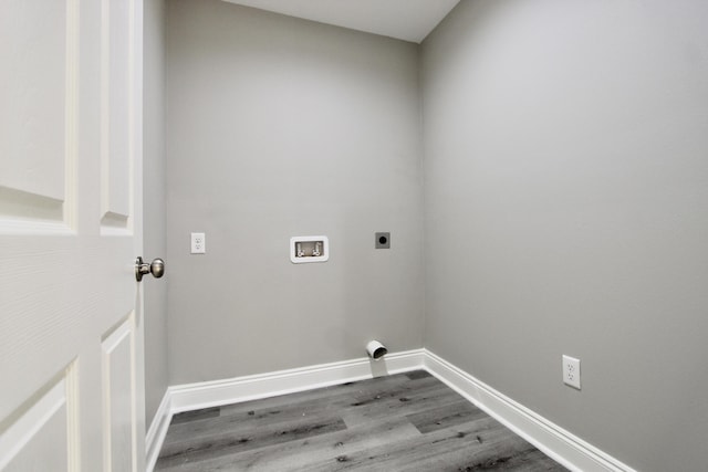 laundry room featuring laundry area, dark wood-style flooring, electric dryer hookup, baseboards, and hookup for a washing machine
