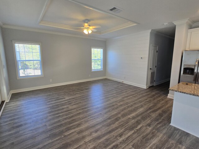 467 N County Highway 395, Santa Rosa Beach, FL 32459 - interior space with visible vents, crown molding, baseboards, dark wood-style floors, and a tray ceiling