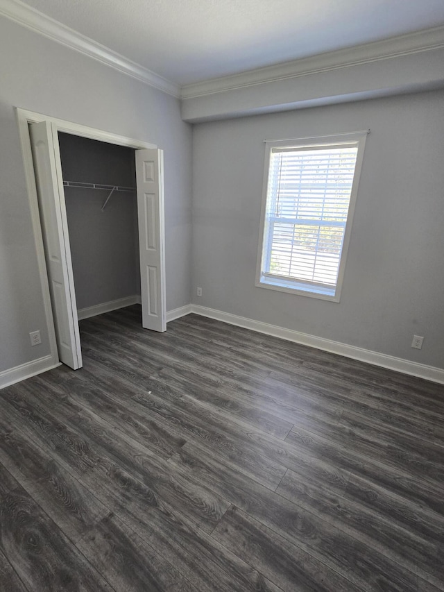 467 N County Highway 395, Santa Rosa Beach, FL 32459 - unfurnished bedroom with crown molding, baseboards, a closet, and dark wood finished floors