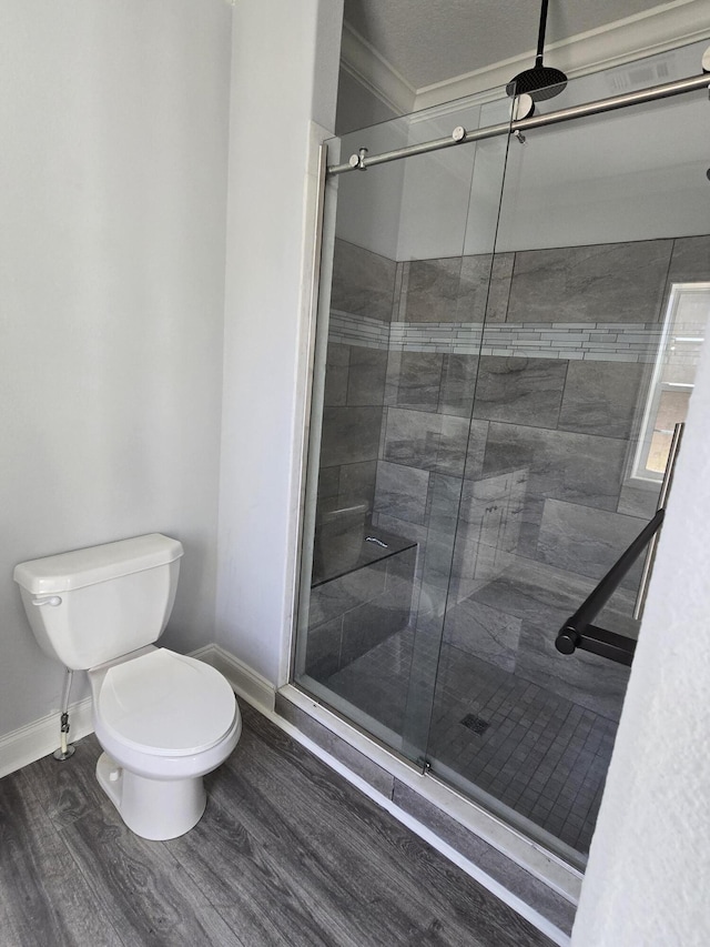 467 N County Highway 395, Santa Rosa Beach, FL 32459 - bathroom featuring baseboards, a shower stall, toilet, and wood finished floors