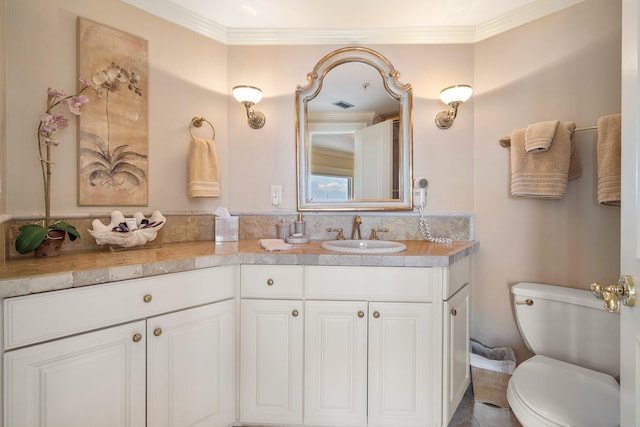 240 Gulf Shore Dr Unit 433, Destin, FL 32541 - bathroom featuring vanity, toilet, and ornamental molding