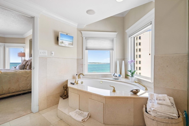 240 Gulf Shore Dr Unit 433, Destin, FL 32541 - bathroom with ensuite bathroom, a bath, wainscoting, ornamental molding, and tile patterned flooring