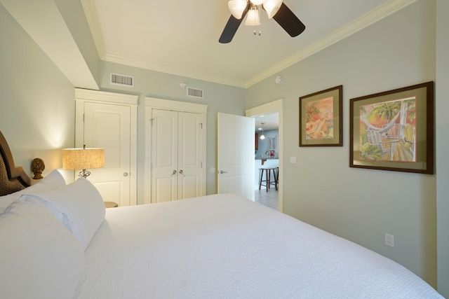 bedroom featuring crown molding, ceiling fan, and visible vents